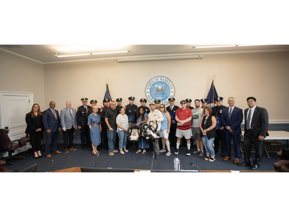 Babylon Town officials, Suffolk County police officers and community members gathered during a recent Town Board meeting to recognize officers for their life-saving response to a pediatric cardiac arrest emergency in West Babylon.