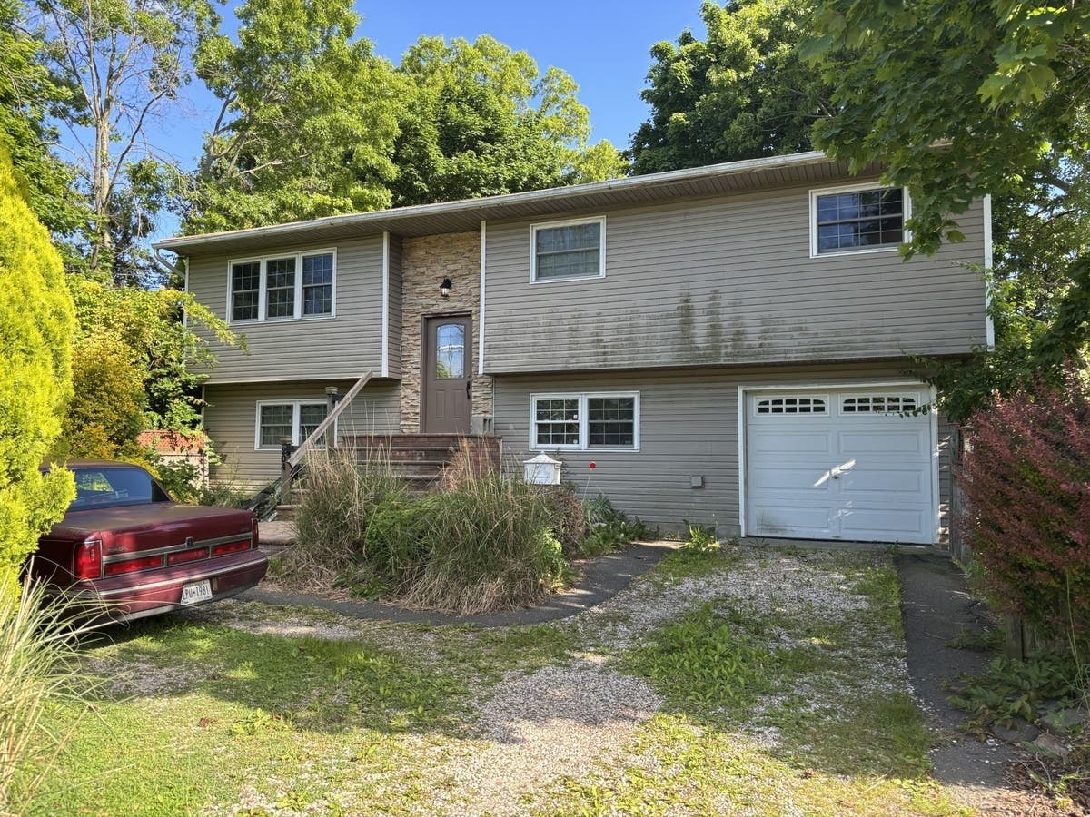 A Cedarwood Street home in Islip Terrace, where Suffolk County police said a woman operated a residential brothel for more than a decade.