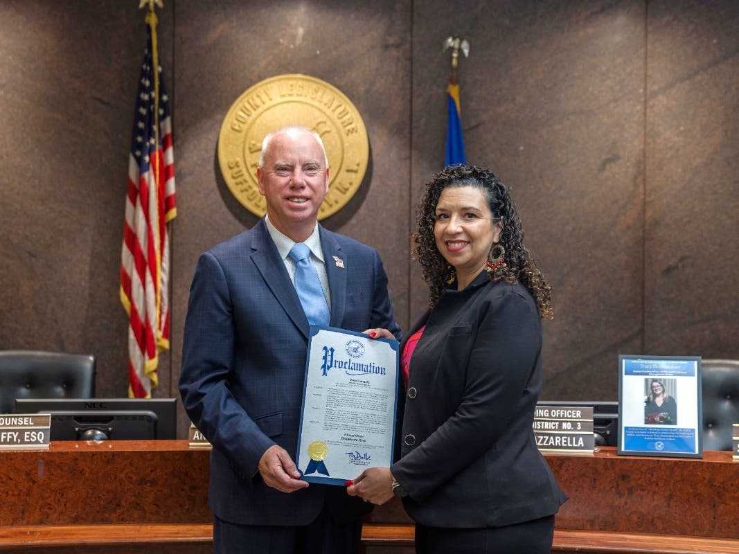 Suffolk County Legislator Tom Donnelly presented a County Proclamation to Cheryl Otero
of Deer Park as his Healthcare Hero for 2026, before the June 2 General Meeting of the
Legislature in Hauppauge.
