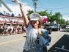 A participant waves to the crowd during the 7th Annual Babylon Pride Parade on Deer Park Avenue in Babylon Village.  