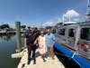 Town of Babylon officials, Bay Constables and members of Richard L. Brooks’ family gather beside the town’s new 31-foot Harbor Patrol Safeboat, named in honor of the fallen Bay Constable.