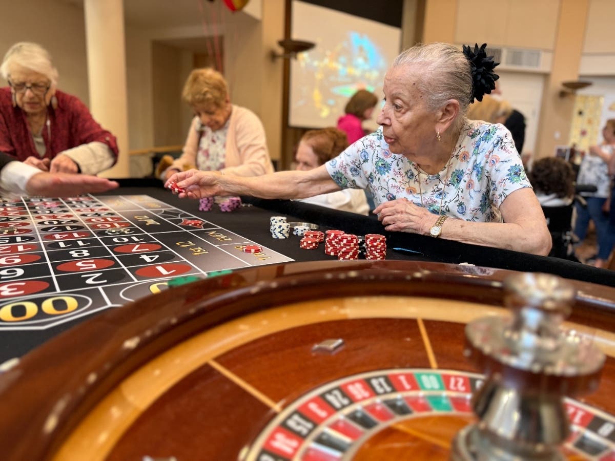 Residents take part in “Games at Grossinger’s,” a casino-themed event during Gurwin Assisted Living’s 25th anniversary celebration.