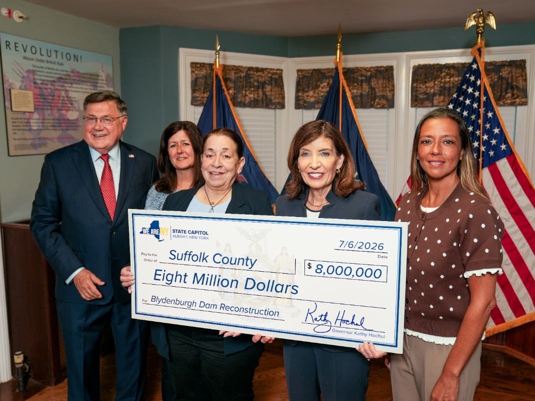 County Executive Ed Romaine, Suzanne Perri from Assemblyman Michael Fitzpatrick’s Office, Legislator Leslie Kennedy, Governor Kathy Hochul and State Senator Monica Martinez held a ceremonial $8 million check for the reconstruction of the Blydenburgh Dam.