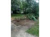 Damage to trees and landscaping marks the path of a Jeep that crossed multiple properties before striking a Hauppauge home, police said.