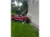 A Jeep struck the side of a Hauppauge home after rear-ending another vehicle near Smithtown Bypass and Plaisted Avenue, police said.  