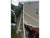 A Jeep is seen lodged against a home on Adrienne Lane after its driver suffered an apparent medical episode, police said.