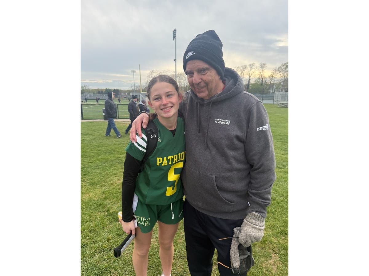 Molly Combs, left, with her grandfather Nick Schroeder, a retired Smithtown athletic director.