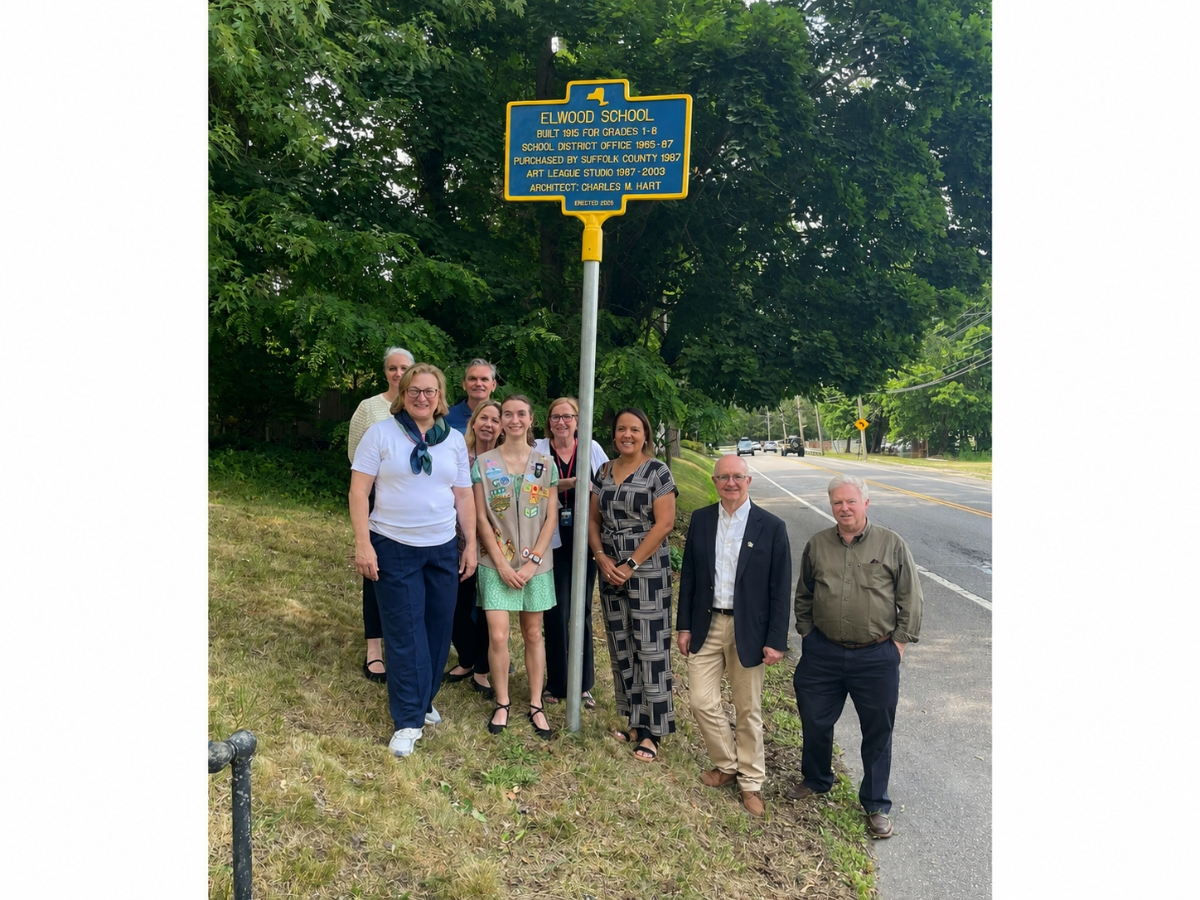 Elwood-John H. Glenn High School graduate and Girl Scout Sophia Vitevitch unveiled a historical marker June 17 commemorating the district’s former Elwood Schoolhouse.