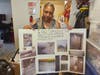 Tina Shuford, tenant union president at 100 Terrace Ave. in Hempstead, holds a display board of photos she said document leaks, pests, elevator issues and other conditions at the apartment complex.  