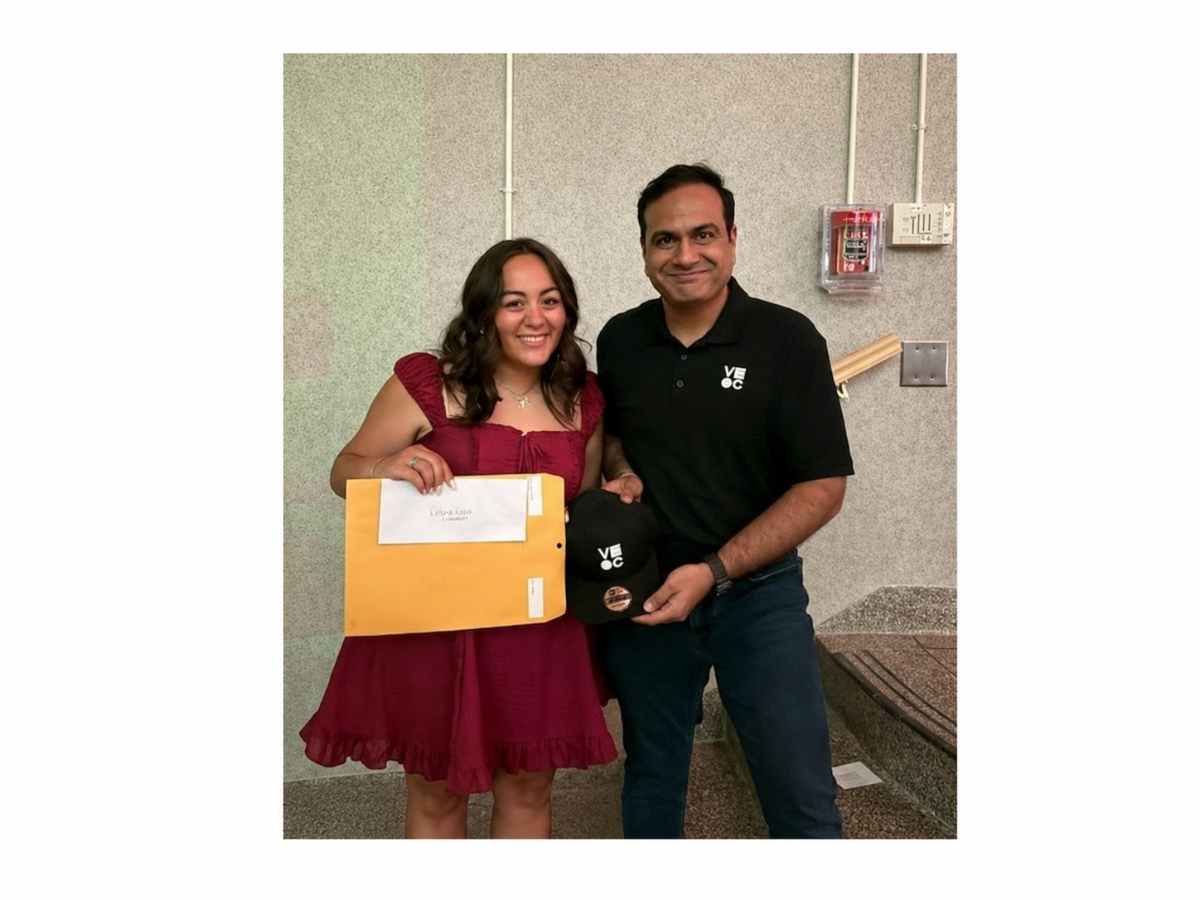 Azim Bootwala, Vice President of Operations at Visual Citi (right), presents
scholarship award to Lindenhurst High School graduating senior Victoria Ogilvie.