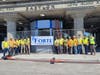 Forte Construction crew members gather outside Babylon LIRR Station, where the new 12-car platforms opened two weeks ahead of schedule.