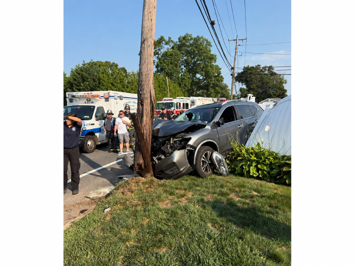 A vehicle crashed into a utility pole at Commack Road and 40th Street in Islip, leaving one person with minor injuries, fire officials said. (Courtesy of the Islip Fire Department)