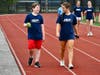 Athletes and peer mentors jog together during an outdoor fitness activity in Bayport-Blue Point.