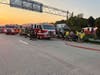 Sayville firefighters and other emergency responders work at the scene of a box truck crash on westbound Sunrise Highway on Aug. 9. Two people were hospitalized with non-life-threatening injuries, police said.  
