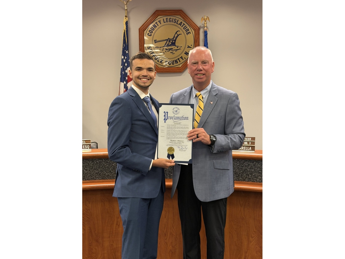 Suffolk Legislator Tom Donnelly honors Suffolk County Legislature Page Program
Participant Matthew Albanese of Dix Hills before the Legislature’s General Meeting on July
14 in Riverhead.