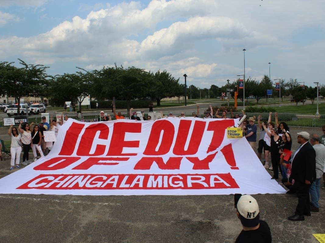 Community organizers, immigrant-rights advocates and faith leaders gathered in a designated protest area outside the Nassau County police training facility during President Donald Trump’s visit Friday.