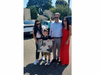 Members of Frank Cassata’s family pose with a photograph of the late businessman during Wednesday’s street dedication in Deer Park. (Patch photo/Kepherd Daniel)