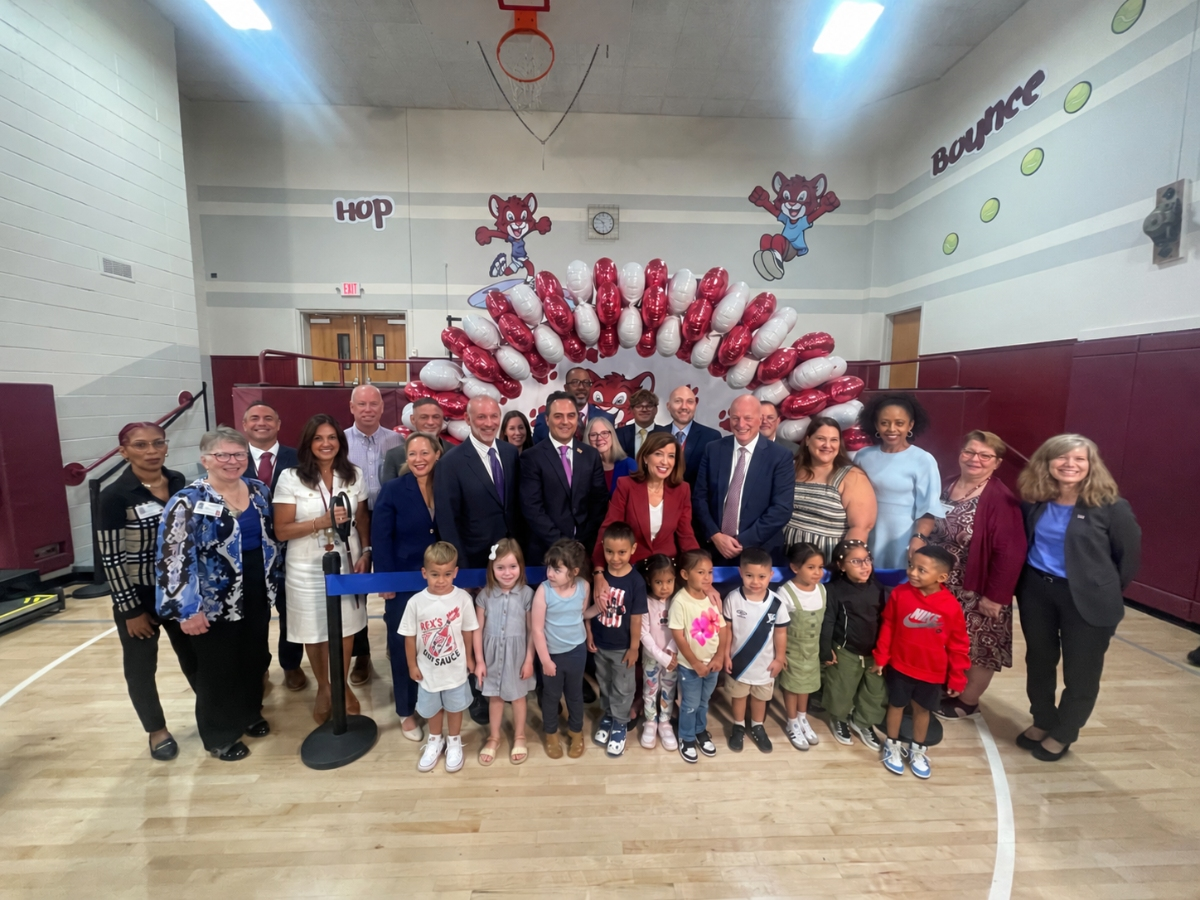 NY Gov. Kathy Hochul (center in red) joins South Huntington faculty, staff, and students to cut the ribbon at the new Silas Wood Pre-K Center.