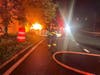 Sayville firefighters work to extinguish a vehicle fire following a crash on the Sunrise Highway service road Wednesday morning.