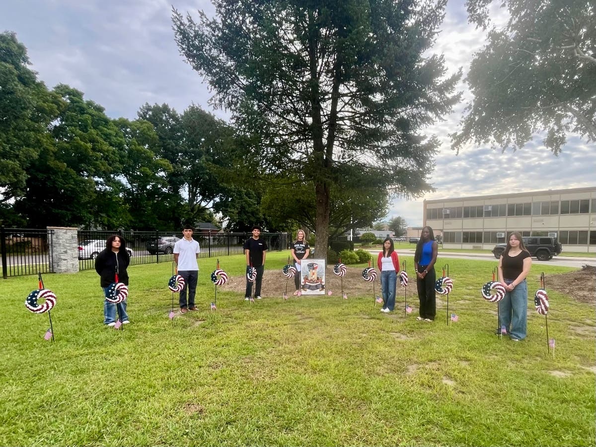 Members of Deer Park High School's Patriot Club placed 12 wreaths honoring Deer Park community members who died in the Sept. 11, 2001, terrorist attacks. The ceremony marked the 25th anniversary of the attacks.