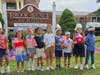 Brook Avenue School students wave their flags.