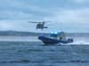 An Army National Guard helicopter flies over Smithtown Bay during a large-scale marine emergency training exercise on Sept. 17.