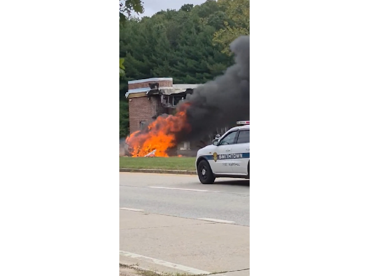 Flames and thick black smoke rise from the Sunken Meadow State Park toll booth area following a fatal crash on Sept. 21. One person was killed, State Police confirmed.