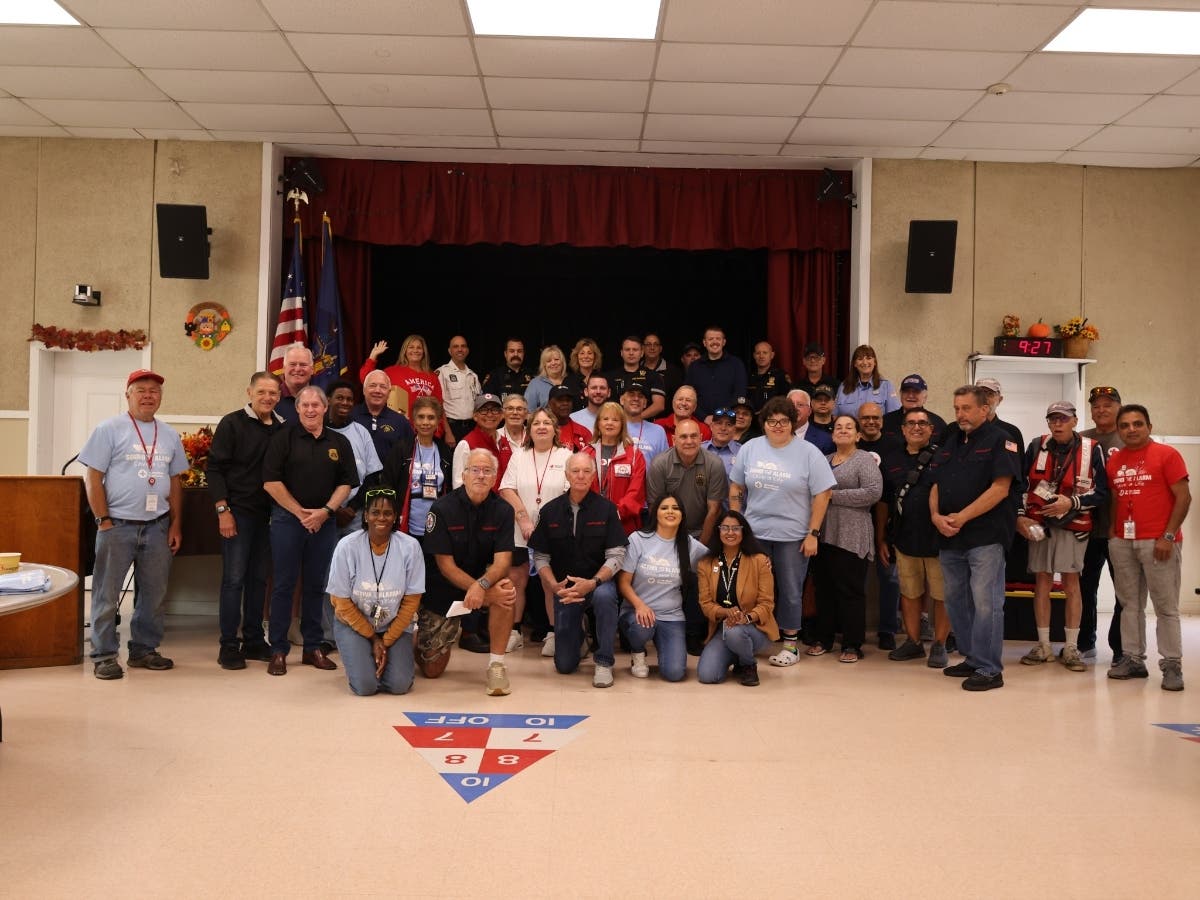 Volunteers and local officials gather during the American Red Cross Home Fire Campaign's free smoke alarm installation event in Smithtown on Sept. 19.