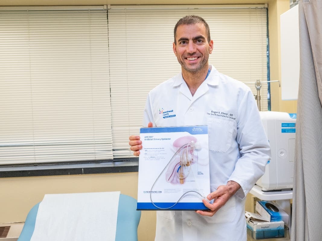 Dr. Roger Khouri displays an artificial urinary sphincter used to treat urinary incontinence in men, including some prostate cancer survivors.