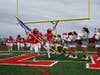 The Smithtown East Bulls take the field at Schroeder Field for their homecoming game against the Huntington Blue Devils.  