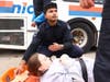 Simulated injured passengers await treatment inside a bus as Zucker School of Medicine students practice responding to a mass-casualty incident. 