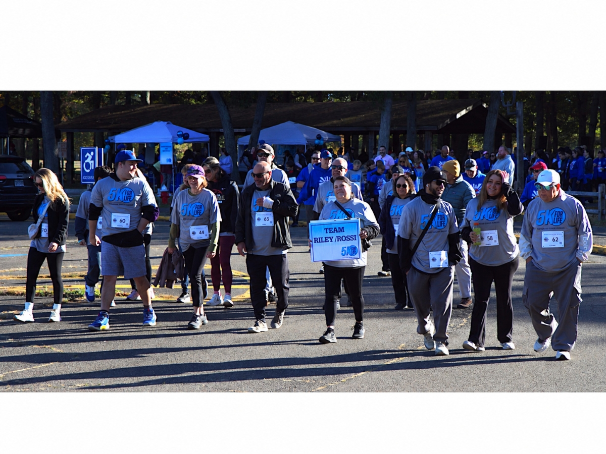 Liver transplant recipient Carlos Riley walks with members of donor hero Claire Rossi’s family during the 2025 Suffolk County 5K For Life Run/Walk. Rossi’s organ donation helped save Riley’s life.