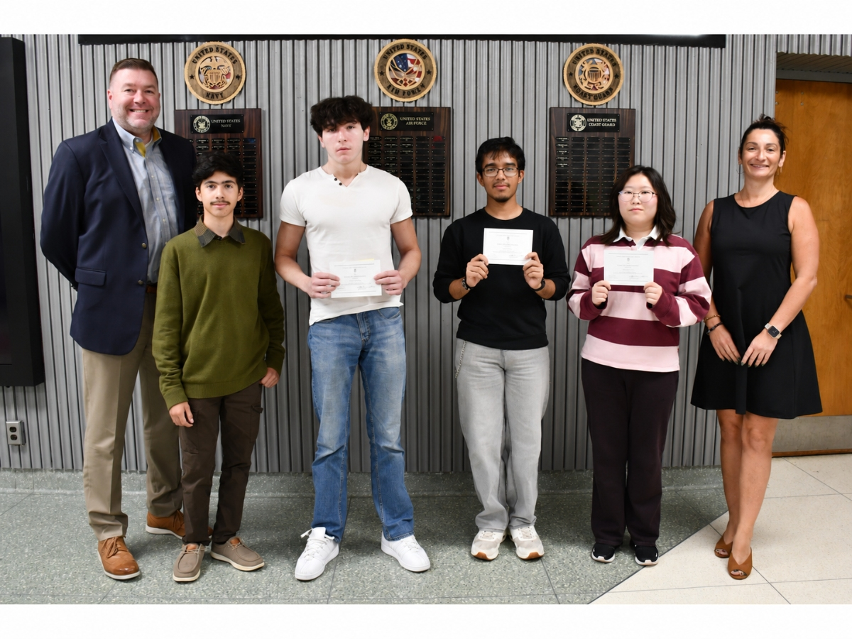 Deer Park High School seniors Vincent Cacciola, Kimberly Cho, Nobin Nath and Joseph Reina, all recognized in the 2027 National Merit Scholarship Program, with Principal Charlie Cobb and Associate Principal Dr. Dina Peragine.