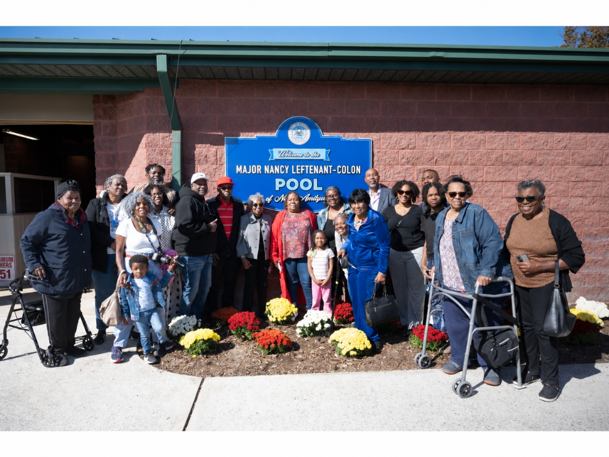 Family members, elected officials and community members gather at the newly dedicated Major Nancy Leftenant-Colon Pool in North Amityville.