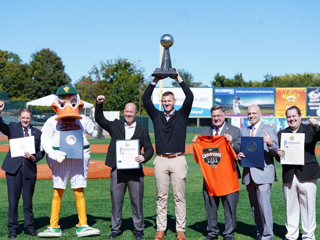 Suffolk County officials and Long Island Ducks representatives celebrate the team’s 2026 Atlantic League championship at Fairfield Properties Ballpark.