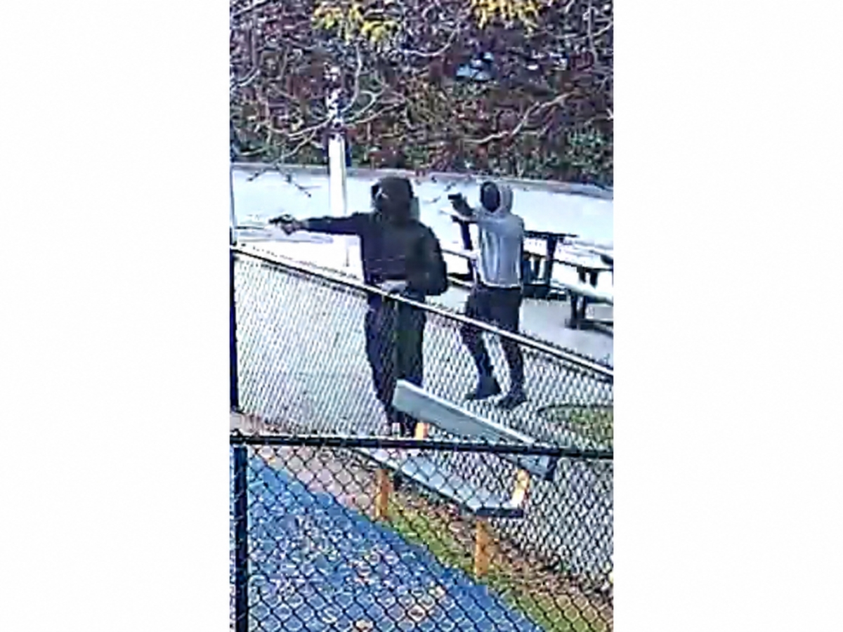 Suffolk County police are searching for two men accused of recklessly endangering a child during an armed confrontation at Bolden Mack Park in North Amityville on Oct. 5.