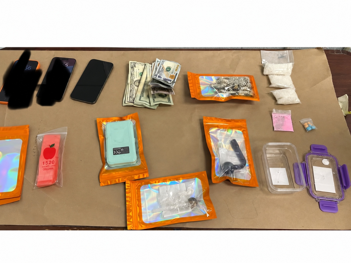 Drugs, cash and other items displayed following the arrest of a Coram man at a Huntington Station motel on Oct. 8. Police said the man was found with 80 grams of crystal methamphetamine and other drugs. 