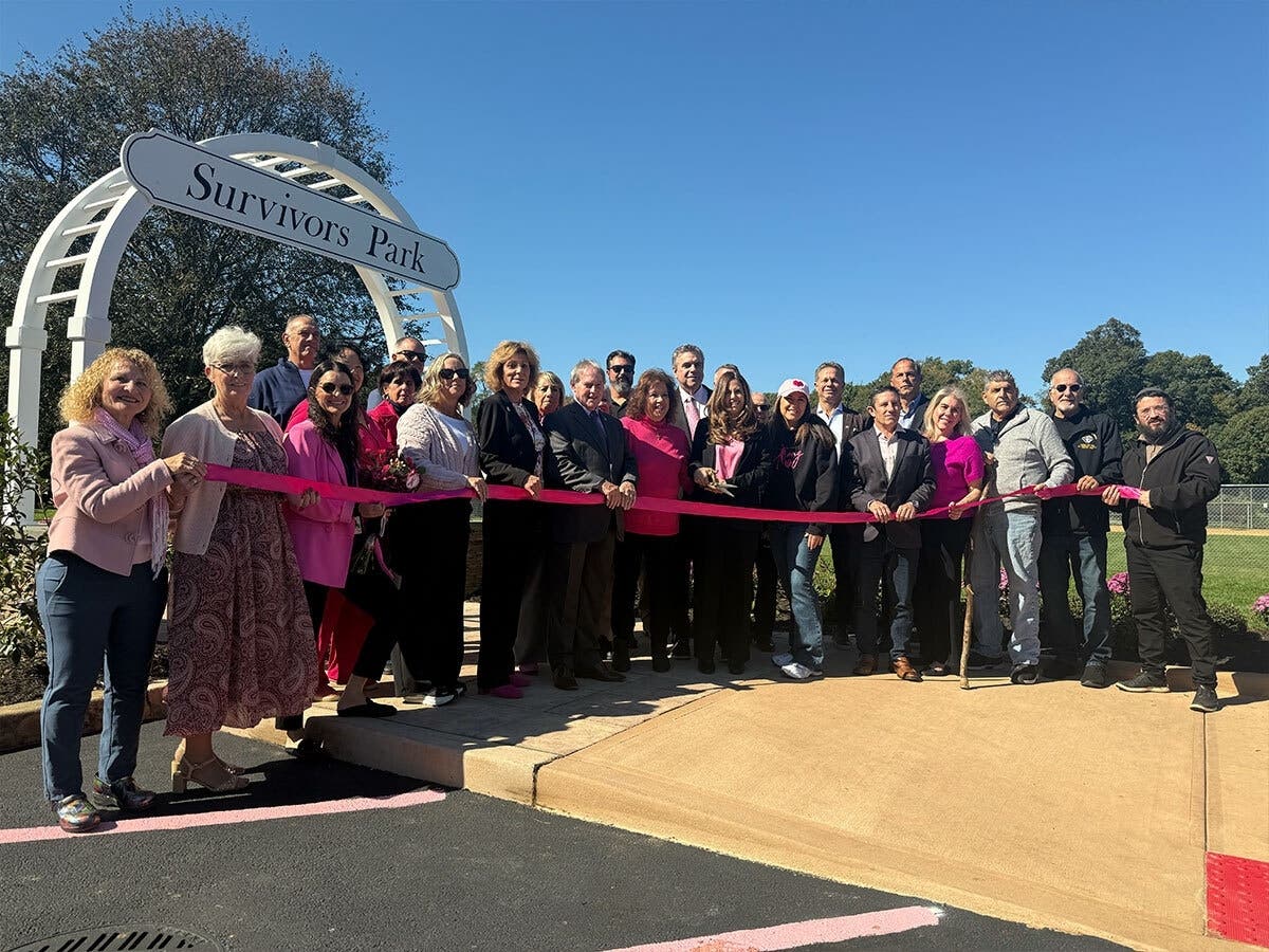Town of Smithtown officials, breast cancer survivors and community partners gather for a ribbon-cutting ceremony celebrating the opening of Survivors Park in Commack on Oct. 7.