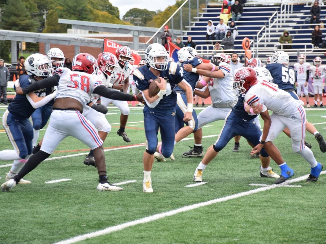 A Northport High School football player carries the ball during the Tigers' 31-0 Homecoming victory over Bellport.