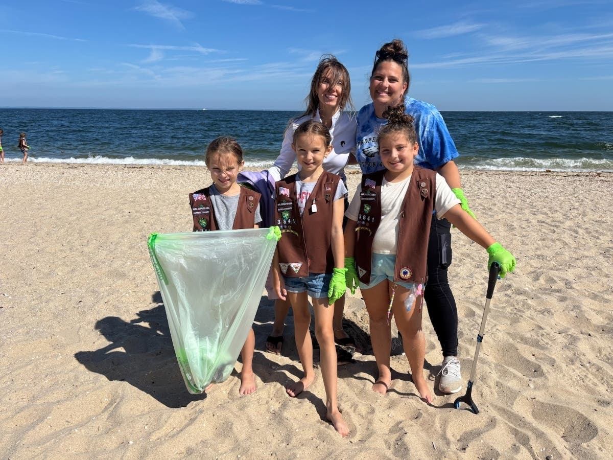 Girl Scouts Zoe Emerson, Kinley Emerson and Rosalie Ferruggio, front row, and Alexa Emerson and Erika Orbon, back row, at Sunken Meadow State Park in Kings Park, where Girl Scouts participated in a beach cleanup on Sept. 13.