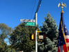 The Sorrentino Way street sign stands above Union Place in Huntington, honoring the late Andrea and Luisa Sorrentino.