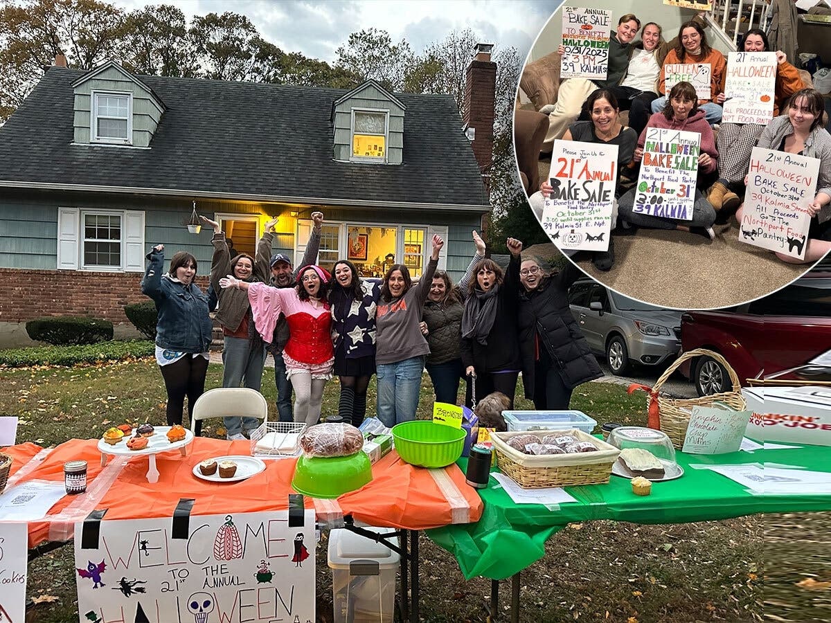 Costumed volunteers gather outside the Perles family home in East Northport during the annual Halloween bake sale, which benefits the Northport Food Pantry. 
