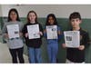 (from left) Francesca Guigno, Emma Palumbo, Bella Ramoutar and Dominic Egan became members of the Seaford press corps as part of their nonfiction unit.  