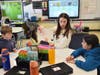 Fifth graders Harry Corsentino and Charlotte Cilla get some extra math help from Wantagh senior Michaila Jung.  