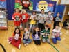 Mrs. McNally’s third grade students pose with the newest part of their personal libraries.