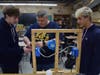 Technology teacher James DeSantis teaches Ryan Iovino, left, and John DiGiorgio how to do electrical work in their residential structures class. 