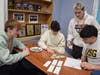 Jake McBride, Caden Bowen, Tony Munteanu and Chris Sultana take instruction in their College Financial Accounting class. 