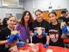 Principal Libby Trencheny joins Lakeside students Alexandra, Chloe and Myla to work on some sandwiches. 