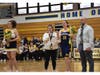 Madison Buckvar and Olivia Razzano (both holding flowers) were recognized on senior night before Wednesday night's game. 