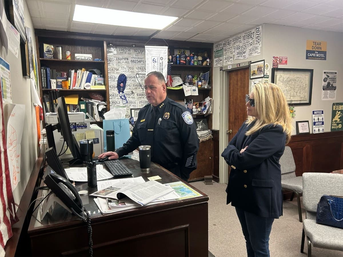 Congresswoman Laura Gillen (right) takes a tour of the Lynbrook police facility with chief Brian Paladino (left)